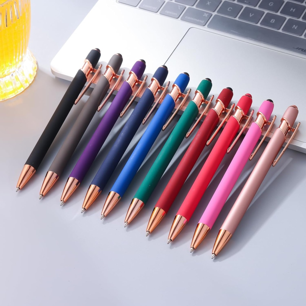 colourful pens on a laptop