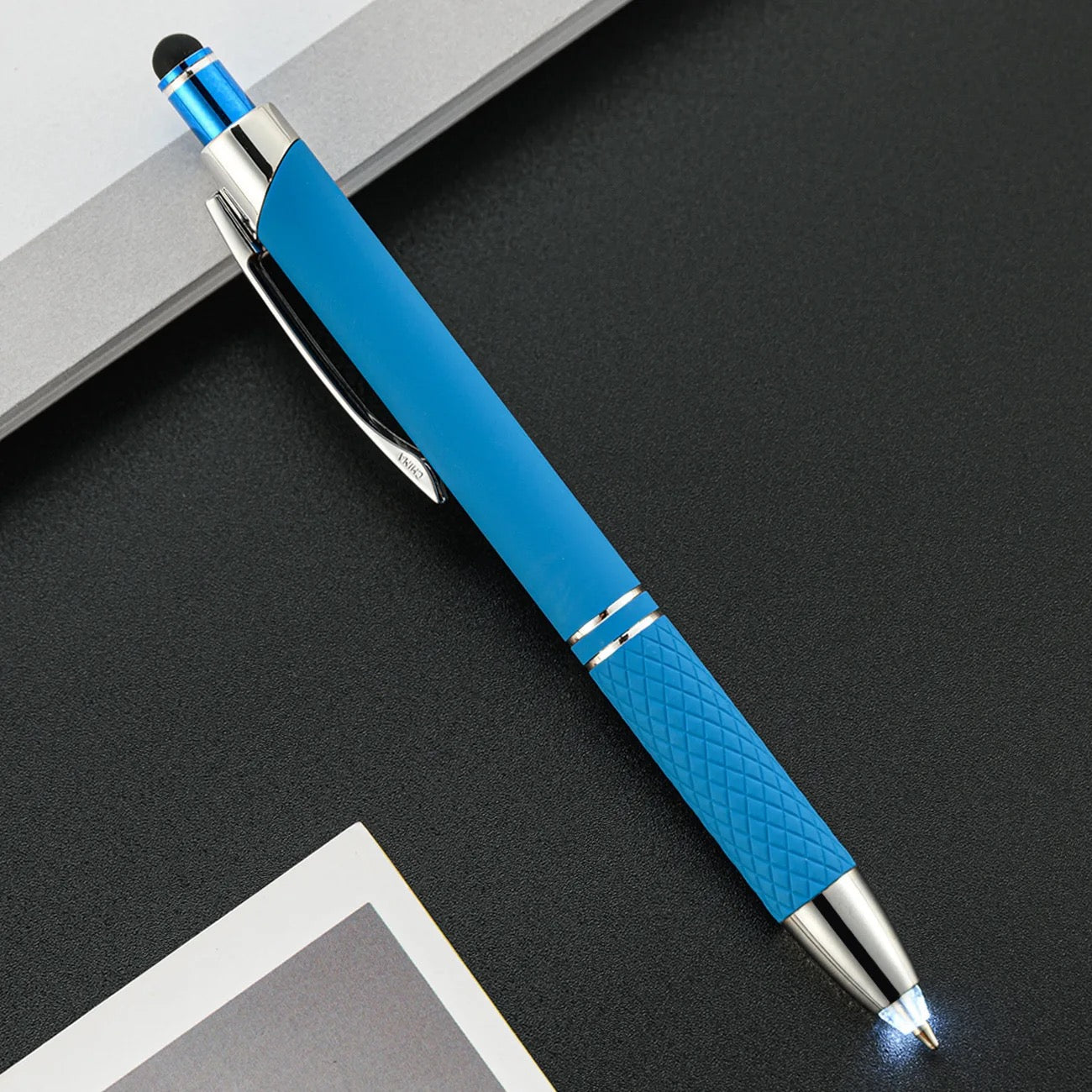 a light blue barrel pen